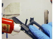 Applying Oil to Metal Guide of Frame Assembly