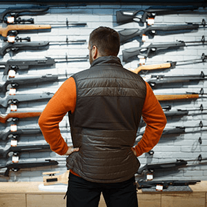man shopping for his first rifle