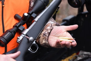 Choosing the Best Hunting Ammo | Hunter Loading a Rifle With Hunting Ammo