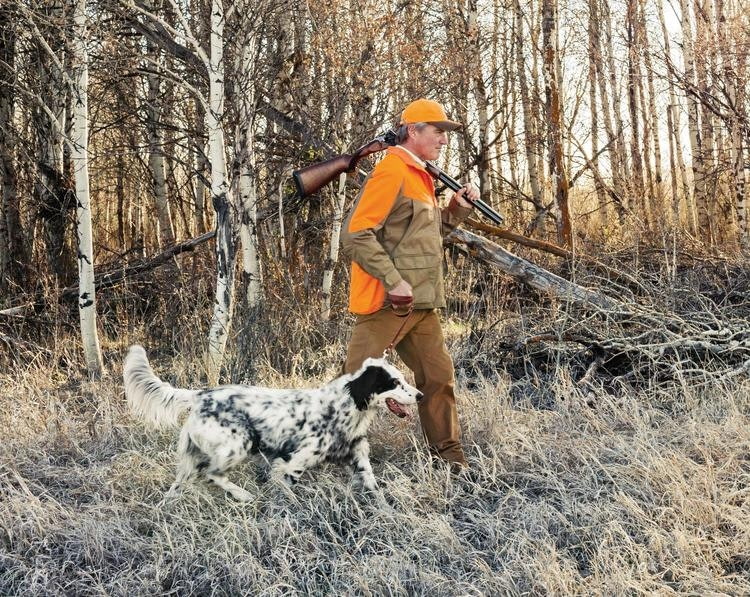hunter wearing blaze orange vest