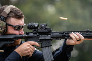 Man aiming through EOTech XPS2