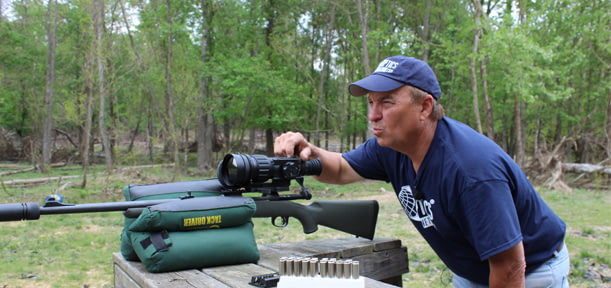 hunter with rifle scope