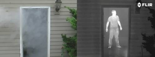 Picture showing a man through a doorway with thermal and a regular optic