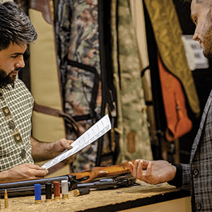 Man Buying a Gun at a Store