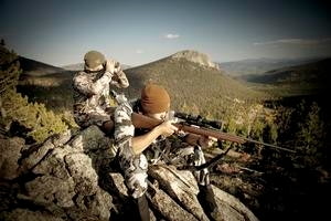 Two People Hunting With Rifle