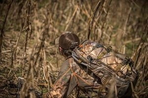 duck hunter wearing marsh camo