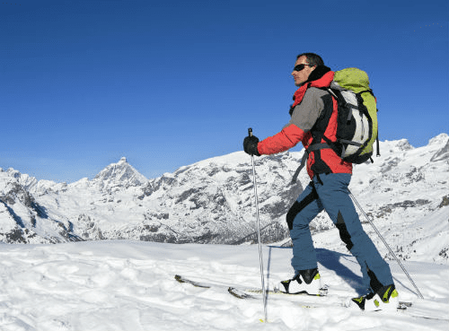 Man Skiing With an Internal Frame Backpack