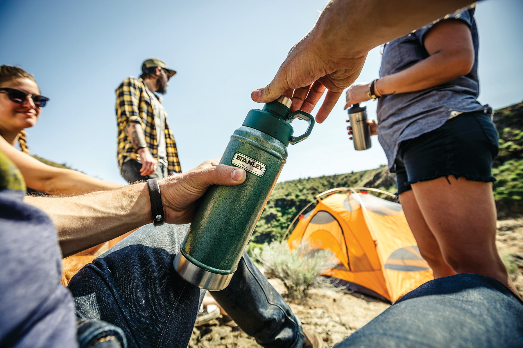 hikers drinking water on trail