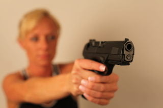 Woman Practicing Dry Fire Techniques