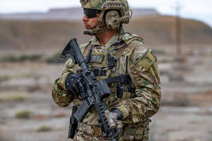 Military man holding rifle with Vortex Razor AMG Holographic Sight